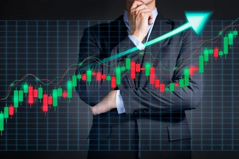 Businessman analyzing rising stock chart with green arrow, symbolizing growth in trading market.